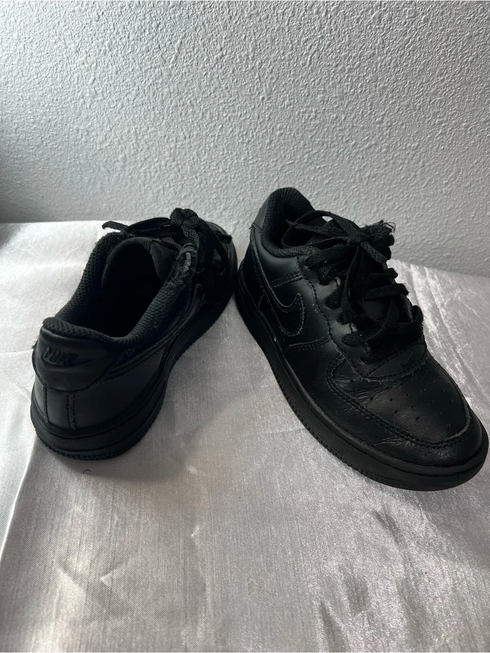Nike Kids All-Black Leather Sneakers